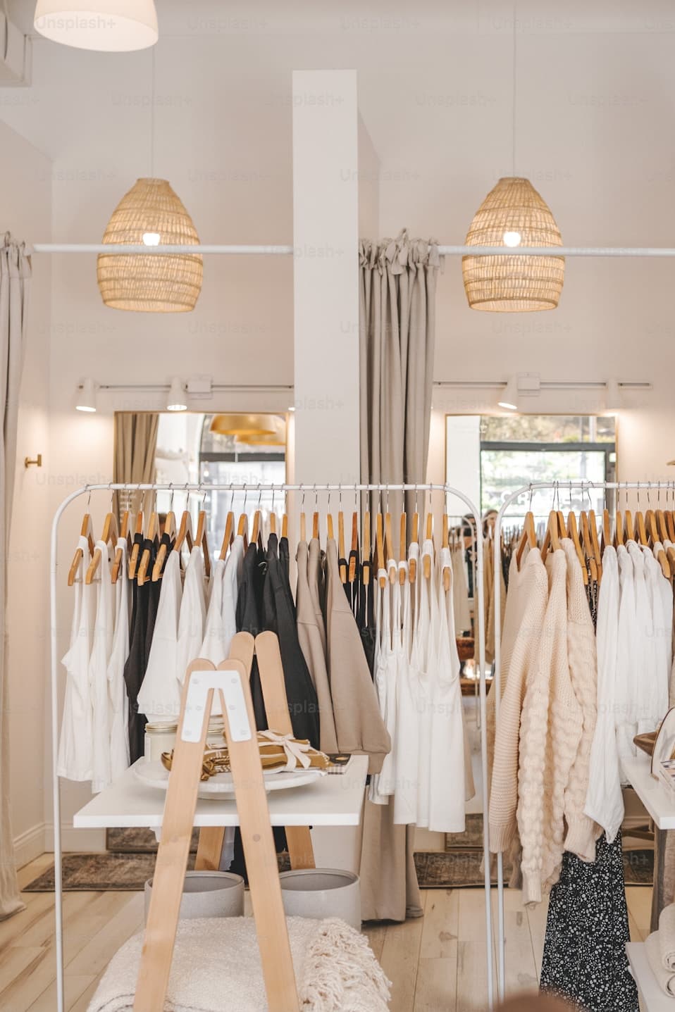 Clothing rails in a small retail storefront